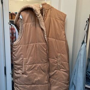 Tan Puffer Vest with Sherpa Lining there is one little mark on the front right.